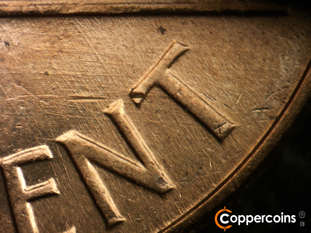 Die-stage A marker on 1960D•1MM•163 showing Crossing die scratches below base into CENT.