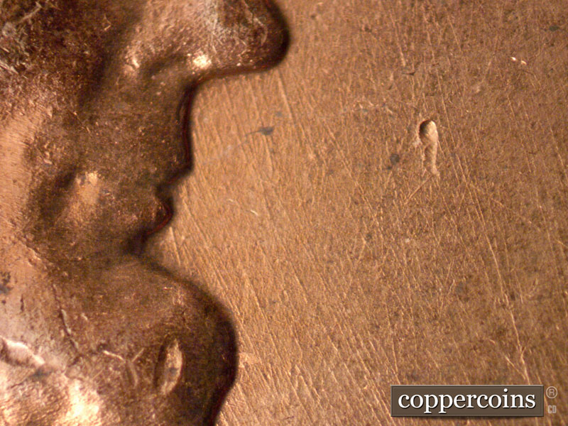 Die-stage B marker on 1960D•1MM•165 (1960 Repunched Mint Mark).