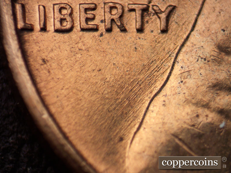 Die-stage B marker on 1960D•1MM•166 (1960 Repunched Mint Mark).