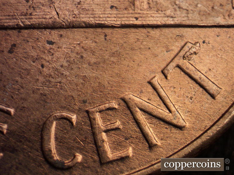 Die-stage B marker on 1960D•1MM•166 (1960 Repunched Mint Mark).