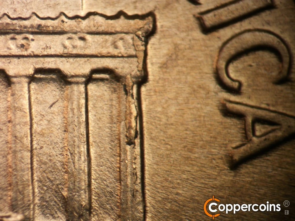 Die-stage A marker on 1960D•1MM•173 showing Die chipping down column 12.