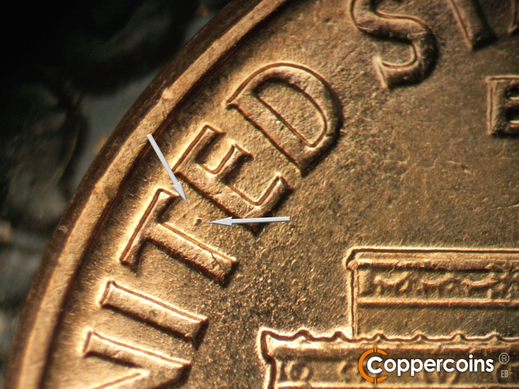 Die-stage B marker on 1960D•1MM•173 showing A heavy die dot show between the T and E of UNITED.