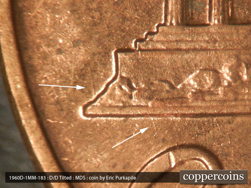 Die-stage B marker on 1960D•1MM•183 showing NNW die scratch from left base toward U in UNITED. SSE die scratch from base toward O in ONE.