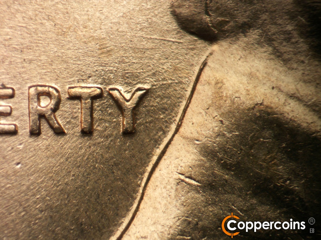Die-stage C marker on 1960D•1MM•183 showing Die scratches through RTY in LIBERTY are starting to wear away.