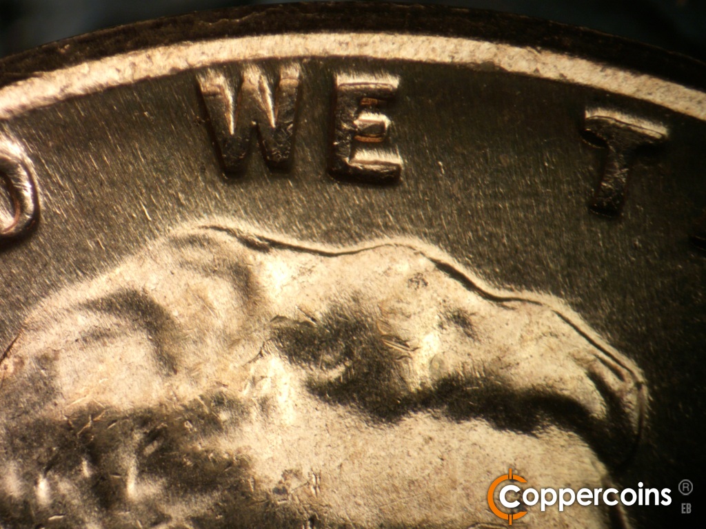 Die-stage C marker on 1960D•1MM•183 showing Die scrath under WE is barely visible.