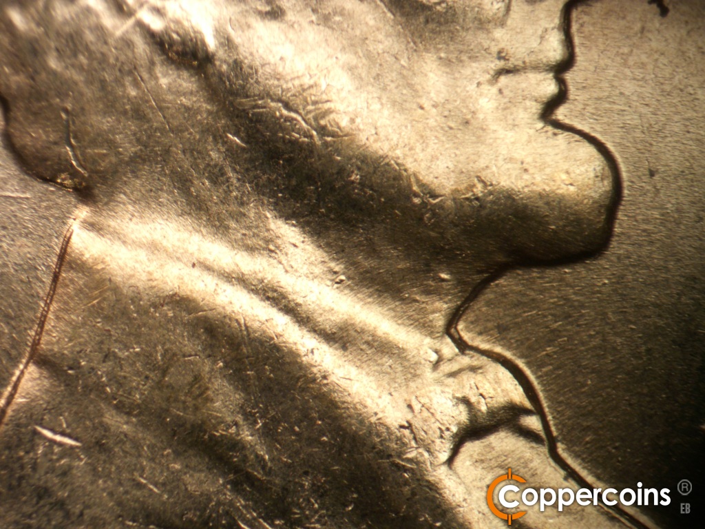 Die-stage C marker on 1960D•1MM•183 showing Die dots on neck.