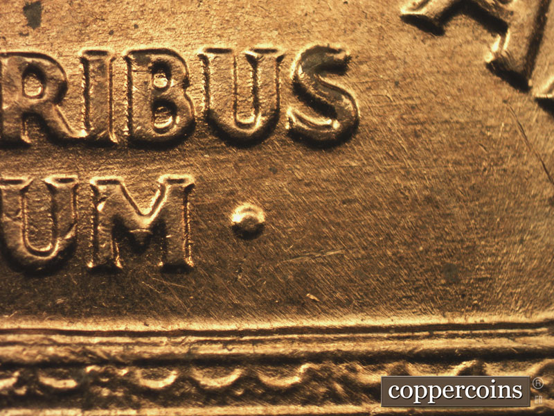 Die-stage C marker on 1960D•1MM•200 showing E/W die scratches through PLURIBUS and UNUM.