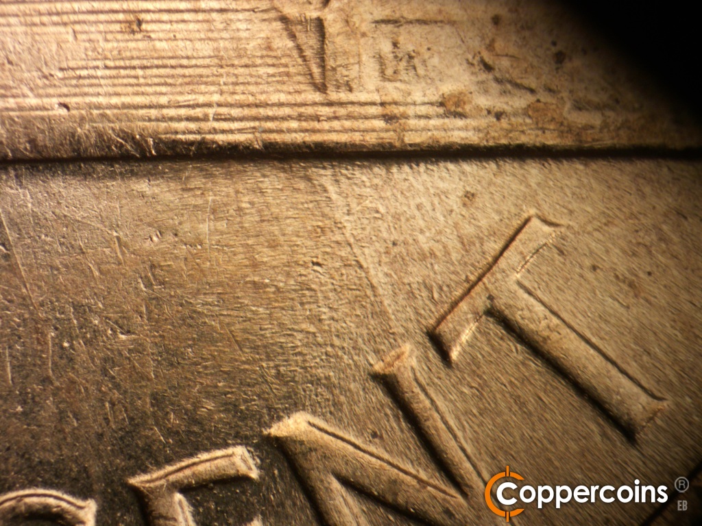 Die-stage B marker on 1960D•1MM•200 showing SSE die scratch from base to N in CENT.