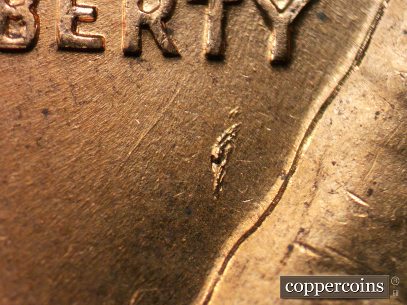 Die-stage B marker on 1960D•1MM•207 (1960 Repunched Mint Mark).