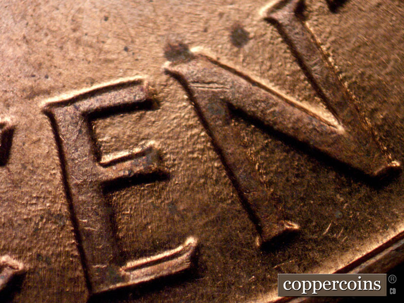 Die-stage B marker on 1960D•1MM•242 (1960 Repunched Mint Mark).