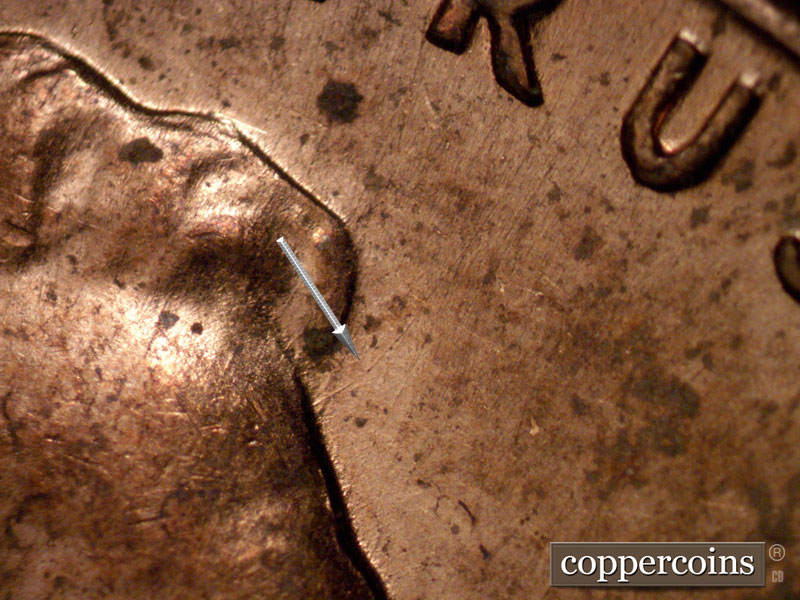 Die-stage B marker on 1960D•1MM•265 (1960 Repunched Mint Mark).