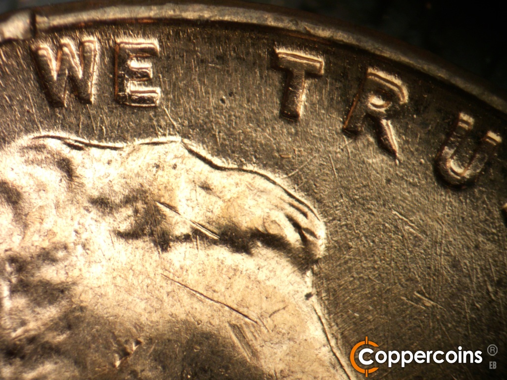Die-stage B marker on 1960D•1MM•295 showing Die scratches under TRUST.