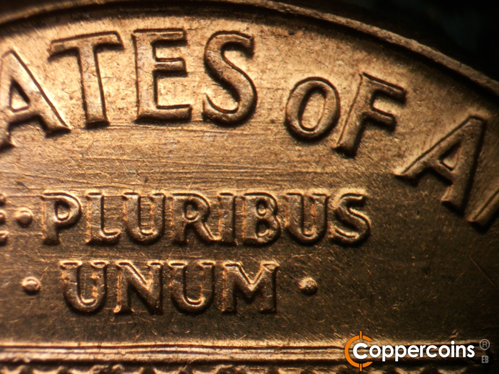 Die-stage C marker on 1960D•1MM•296 showing E/W die scratch between States and E PLURIBUS UNUM.
