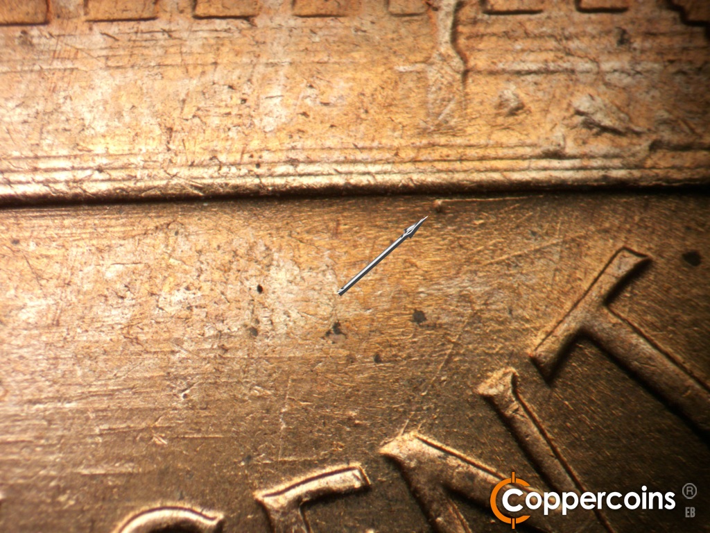 Die-stage C marker on 1960D•1MM•296 showing Die dot under base .