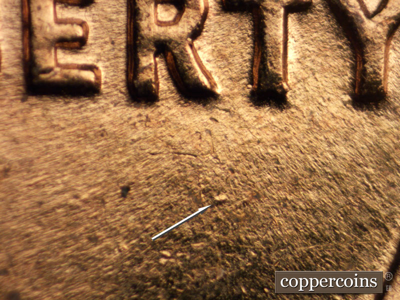 Die-stage B marker on 1961D•1DR•002 (1961 Doubled Die Reverse).