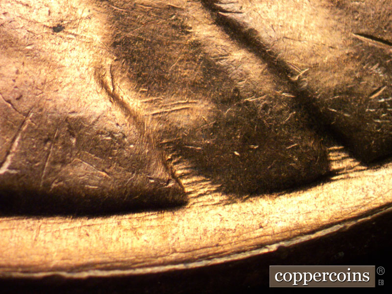 Die-stage B marker on 1961D•1MM•002 (1961 Repunched Mint Mark).