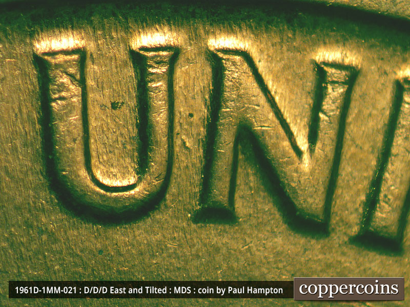 Die-stage A marker on 1961D•1MM•021 showing A die dot shows between the U and N of UNITED.