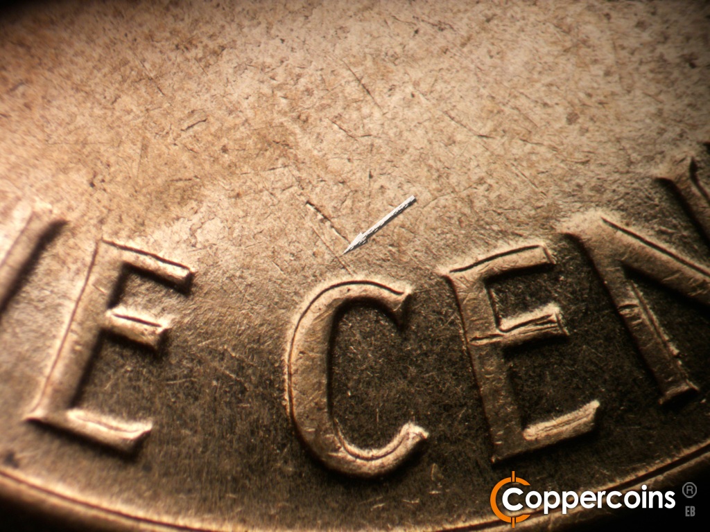 Die-stage B marker on 1961D•1MM•021 showing NW die scratch from top of C in CENT.