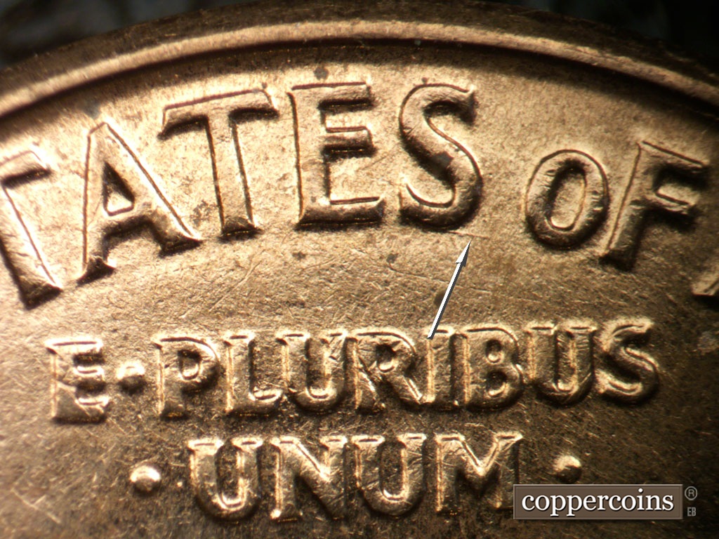 Die-stage C marker on 1961D•1MM•048 showing ESE die scratch from last S in STATES.