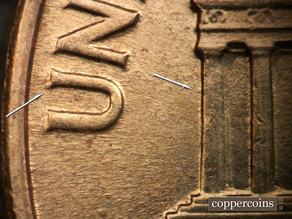 Die-stage C marker on 1961D•1MM•048 showing Die depression near column 1.