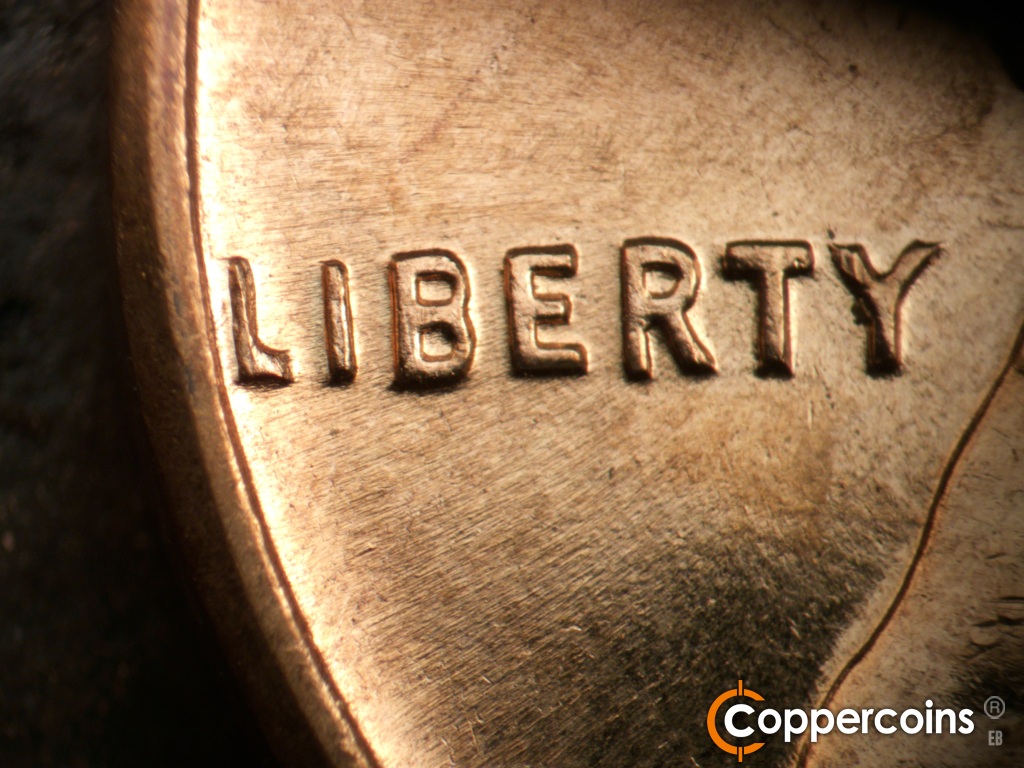 Die-stage A marker on 1961D•1MM•060 showing No die scratch between IB in LIBERTY.