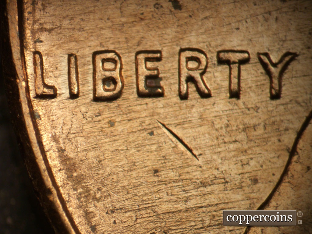 Die-stage B marker on 1961D•1MM•072 showing WSW die scratches through and under LIBERTY.