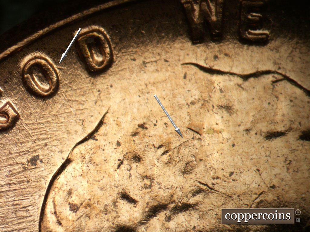 Die-stage B marker on 1961D•1MM•072 showing Short SE die scratch from O in GOD, WSW die scratches through IN GOD.