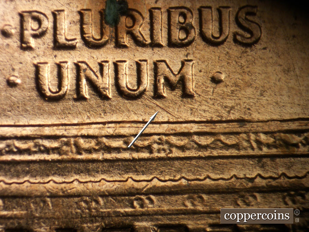 Die-stage B marker on 1961D•1MM•072 showing SE die scratch from second U in UNUM.