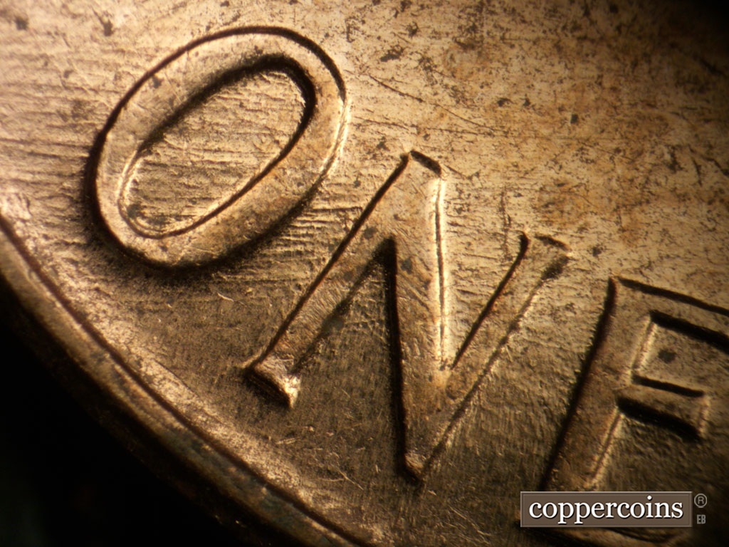 Die-stage B marker on 1961D•1MM•072 showing E/W die scratches through ONE.
