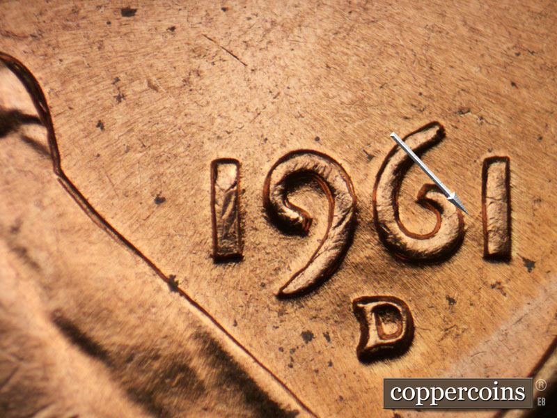 Die-stage B marker on 1961D•1MM•127 showing NE die scratch connects 6 to 1 in date.