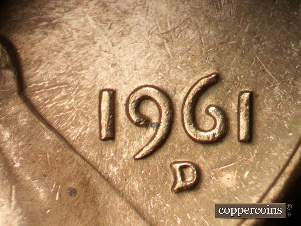 Die-stage C marker on 1961D•1MM•127 showing Date for reference. NE die scratch no longer visible.