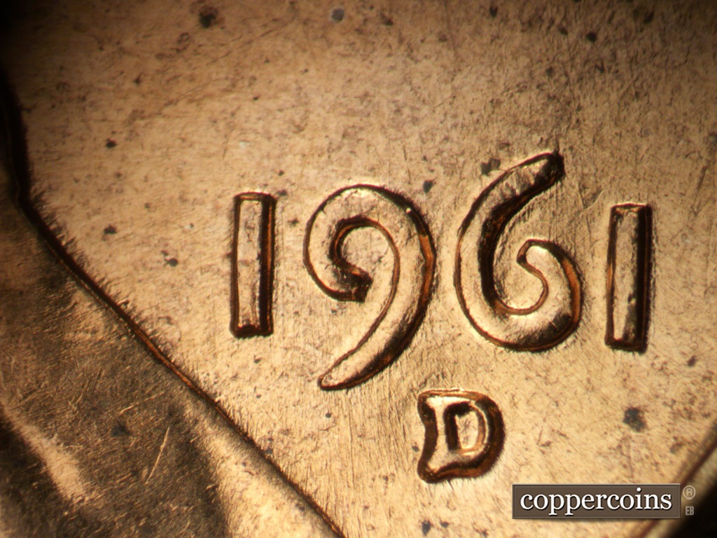 Die-stage B marker on 1961D•1MM•135 showing Curved die scratch between 61 in date.
