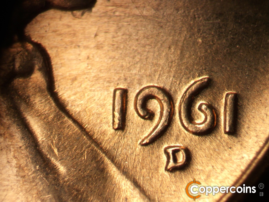 Die-stage C marker on 1961D•1MM•139 showing Worn NNE die scratches from top of 9 in date.