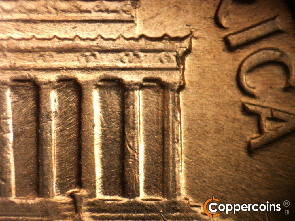 Die-stage C marker on 1961D•1MM•139 showing Die break on right cornice down into column 12.