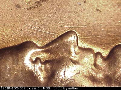Die-stage B marker on 1961P•1DO•002 (1961 Doubled Die Obverse).