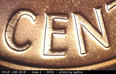Die-stage B marker on 1961P•1DR•001P (1961 Doubled Die Reverse).