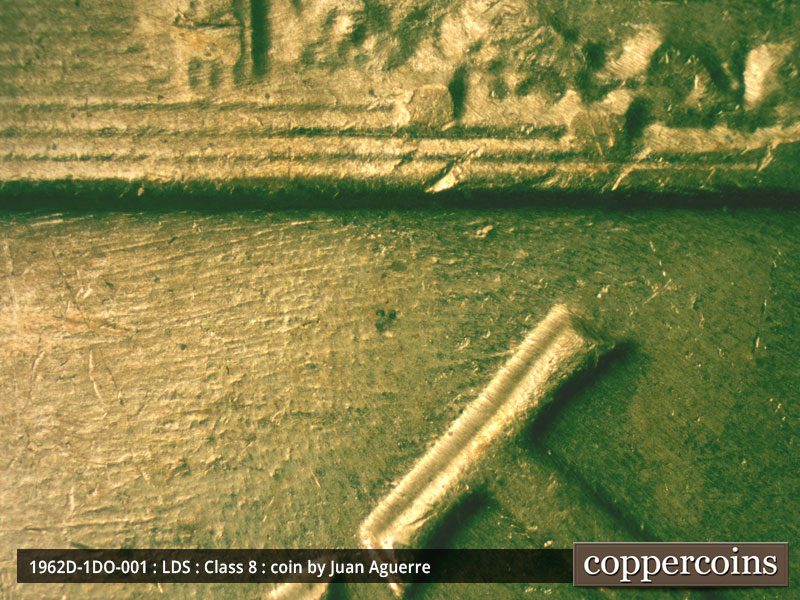 Die-stage C marker on 1962D•1DO•001 (1962 Doubled Die Obverse).