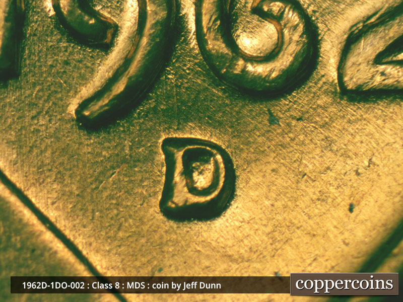 Die-stage B marker on 1962D•1DO•002 (1962 Doubled Die Obverse).