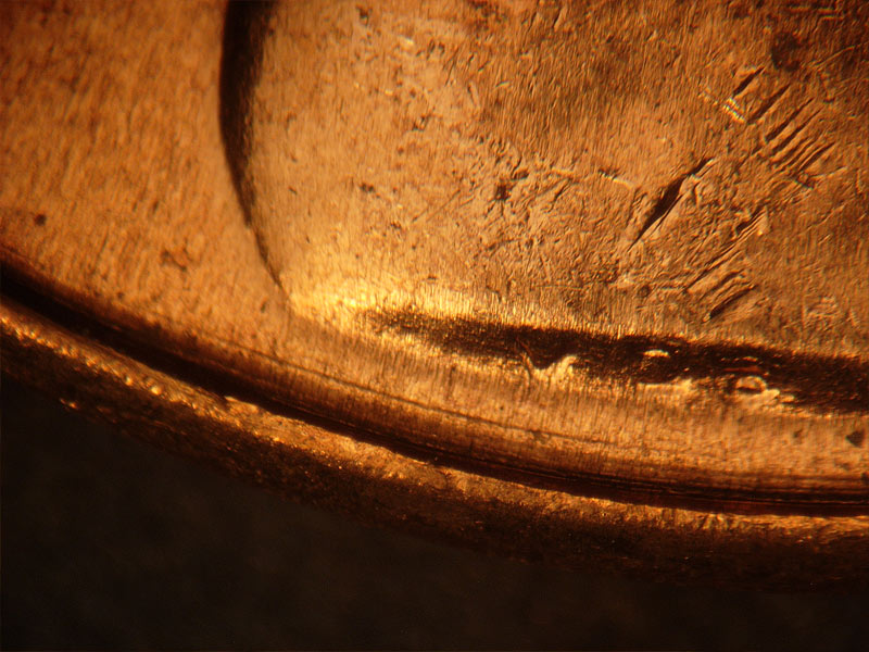 Die-stage B marker on 1962D•1DR•001 (1962 Doubled Die Reverse).