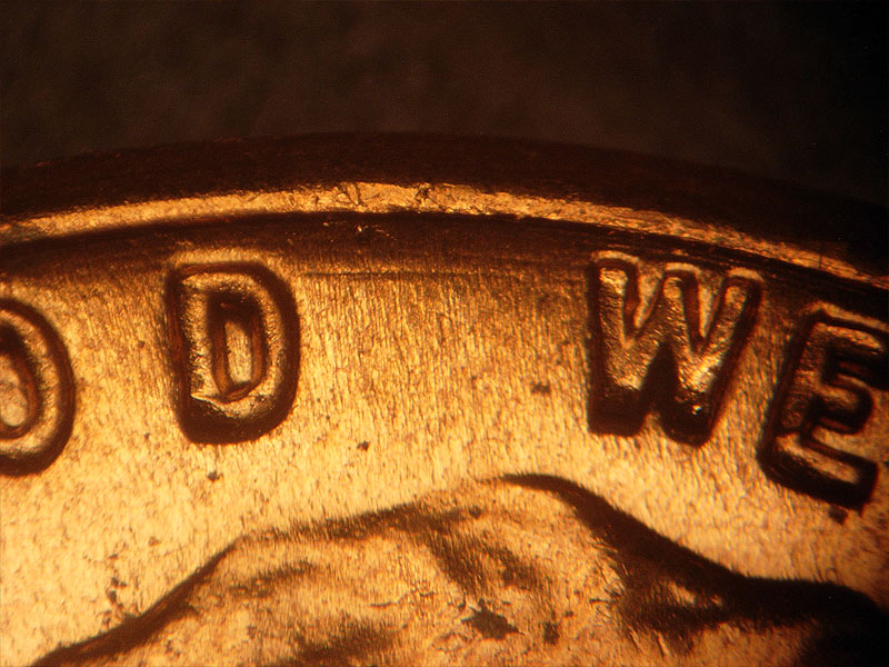 Die-stage B marker on 1962D•1DR•001 (1962 Doubled Die Reverse).