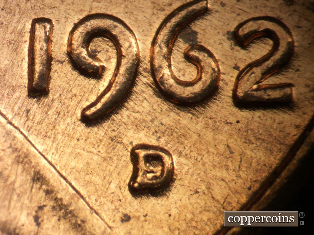 Die-stage A marker on 1962D•1MM•008 showing Closeup of repunched mintmark. NNE die scratches from lapel into 19 of date.