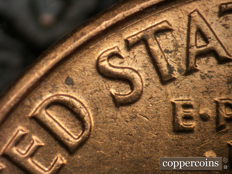Die-stage B marker on 1962D•1MM•032 (1962 Repunched Mint Mark).