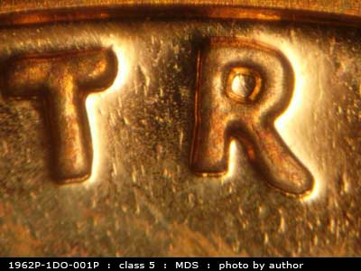 Die-stage B marker on 1962P•1DO•001P (1962 Doubled Die Obverse).