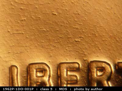 Die-stage B marker on 1962P•1DO•001P (1962 Doubled Die Obverse).