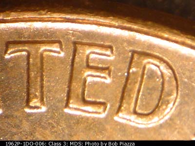 Die-stage B marker on 1962P•1DO•006 (1962 Doubled Die Obverse).