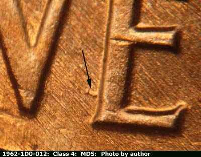 Die-stage B marker on 1962P•1DO•012 (1962 Doubled Die Obverse).