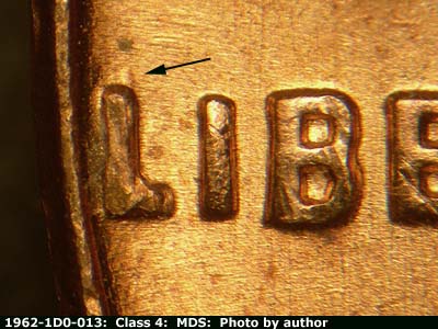 Die-stage B marker on 1962P•1DO•013 (1962 Doubled Die Obverse).