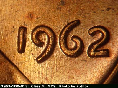 Die-stage B marker on 1962P•1DO•013 (1962 Doubled Die Obverse).