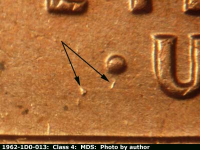 Die-stage B marker on 1962P•1DO•013 (1962 Doubled Die Obverse).
