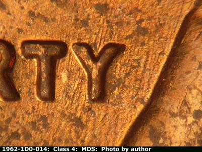 Die-stage B marker on 1962P•1DO•014 (1962 Doubled Die Obverse).